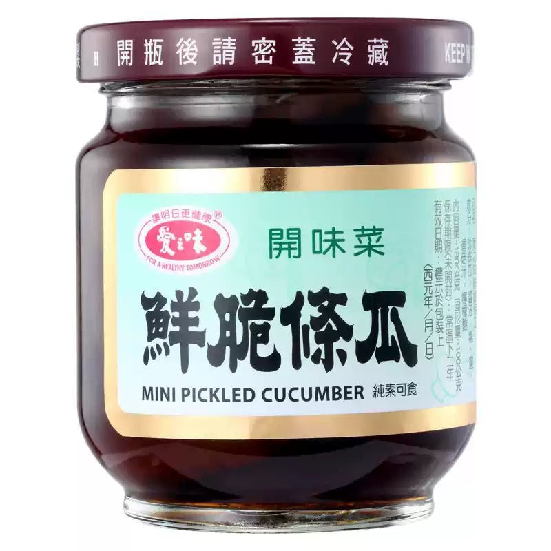 爱之味鲜脆条瓜玻璃瓶装，咸甜口味花瓜条特写，口感爽脆的台湾经典配粥小菜。