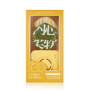 AMORTALS 尔木萄 XL 粉扑套装正面包装图，展示绿色花纹粉扑与黄色相机收纳盒。