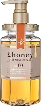 &honey 蜂蜜深层滋润洗发水单瓶正面展示，透明瓶身内含金黄色液体与金色泵头。
