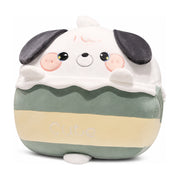 白色背景下的萌趣狗狗造型抱枕，采用绿黄白三色拼接设计，正面绣有Cute字样，具有精致的刺绣五官和立体耳朵。