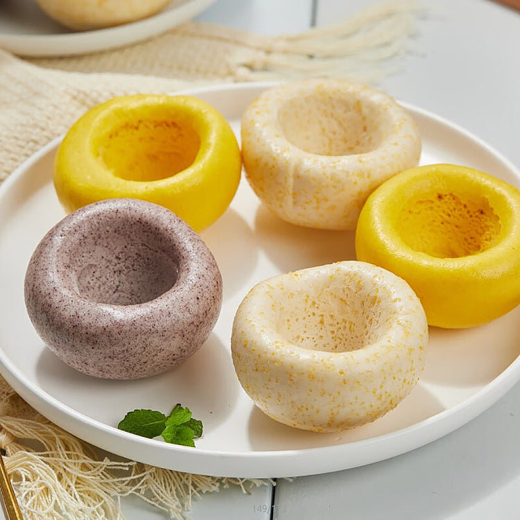 安井杂粮包补充图，展示蒸熟后松软 Q 弹的包子细节