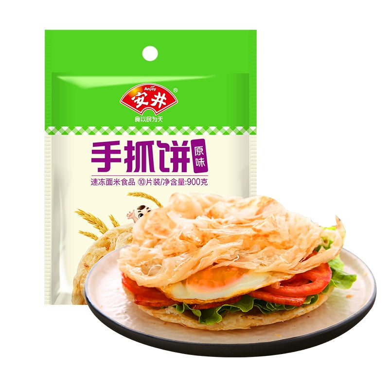 安井原味手抓饼煎制后特写，展示外脆内软的纯麦色饼皮纹理