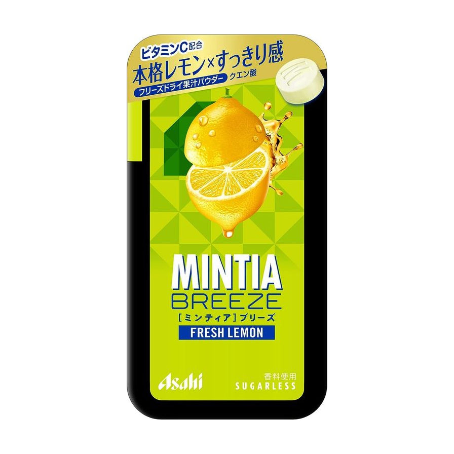 Asahi Mintia Breeze 柠檬叶味大粒薄荷糖，绿色包装盒上印有新鲜柠檬切片图案，右上角展示了一颗白色圆形薄荷糖。