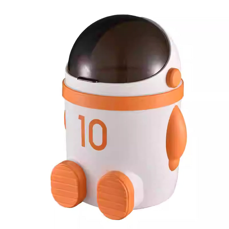 橙色宇航员造型桌面翻盖垃圾桶正面图，10L 容量，放置于白色背景中。