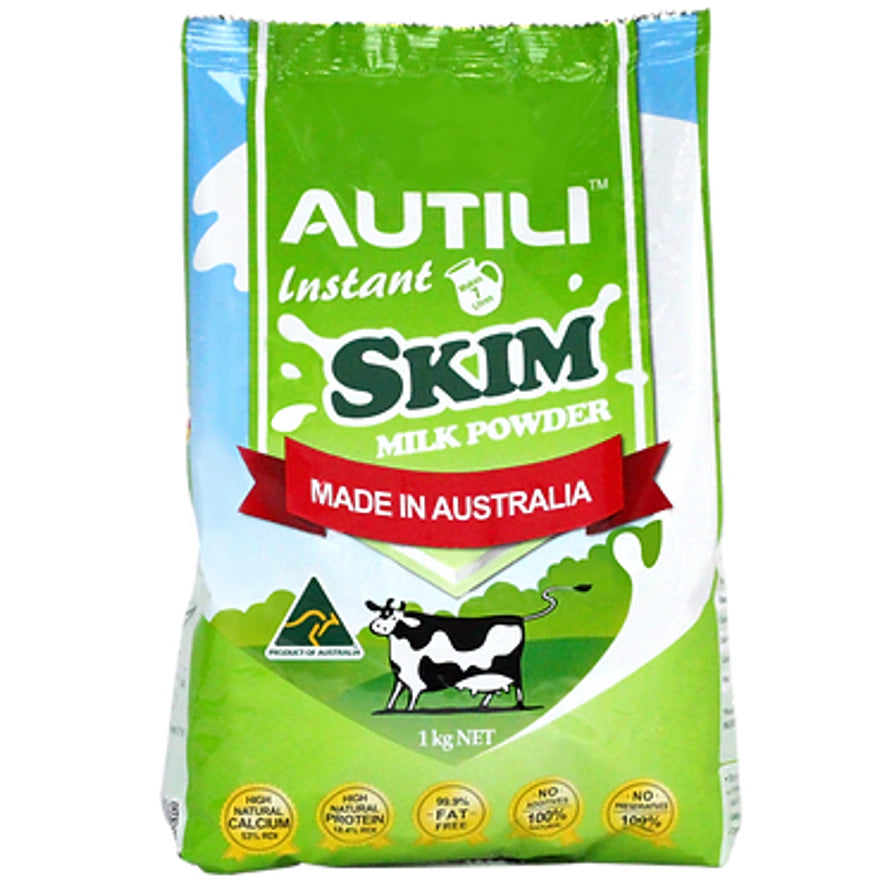 Autili 澳特力脱脂成人奶粉 1kg 绿色袋装，正面印有奶牛图案及澳洲制造标识。