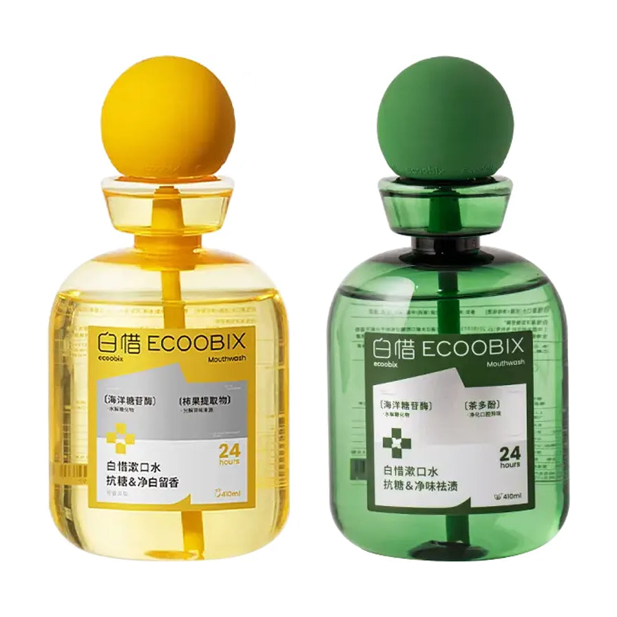 两瓶白惜ECOOBIX漱口水，左侧为黄色瓶装抗糖净白留香款，右侧为绿色瓶装抗糖净味祛渍款，均带有独特的球形瓶盖。