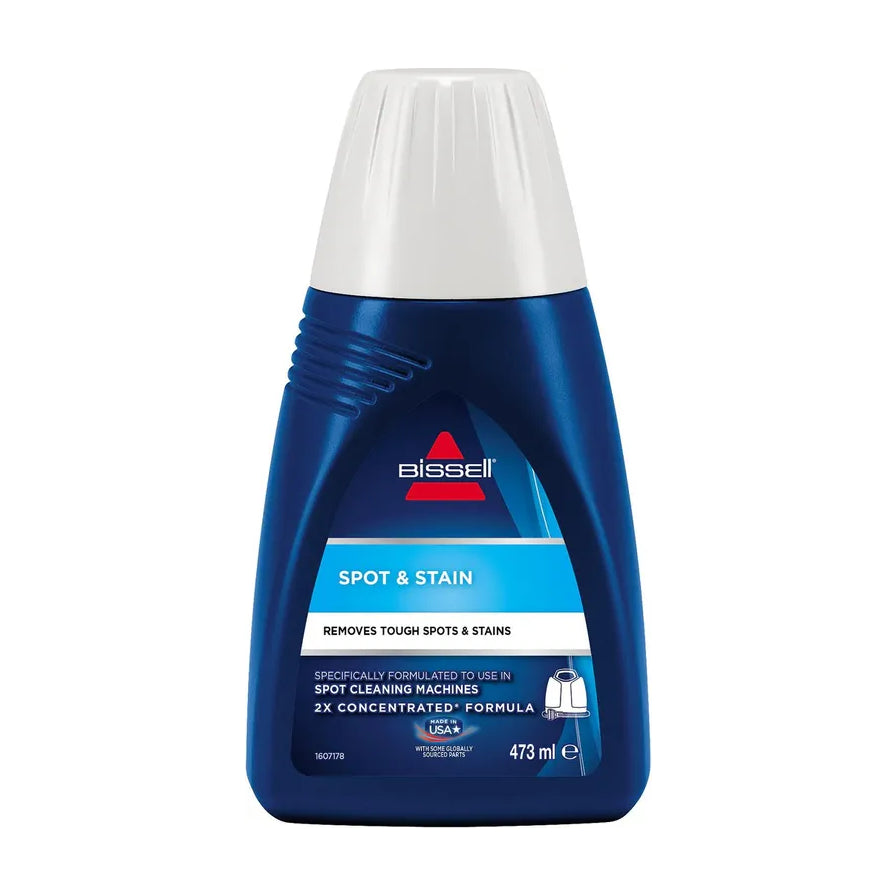 蓝色 BISSELL 瓶装清洁剂正面图，标签写有 SPOT & STAIN、2X CONCENTRATED FORMULA，容量 473 ml