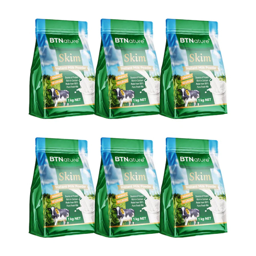 六袋 BTNature 脱脂成人奶粉整齐排列展示，每袋规格为 1kg。