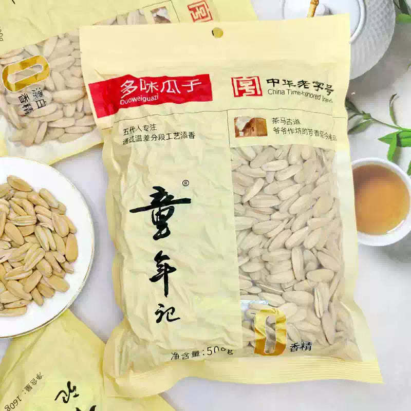 童年记葵花籽包装袋正面展示，红色背景印有品牌 Logo 和产品信息