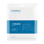 citythere 一次性床单独立包装正面图，白色包装袋配蓝色色块，印有品牌名和床铺示意图。
