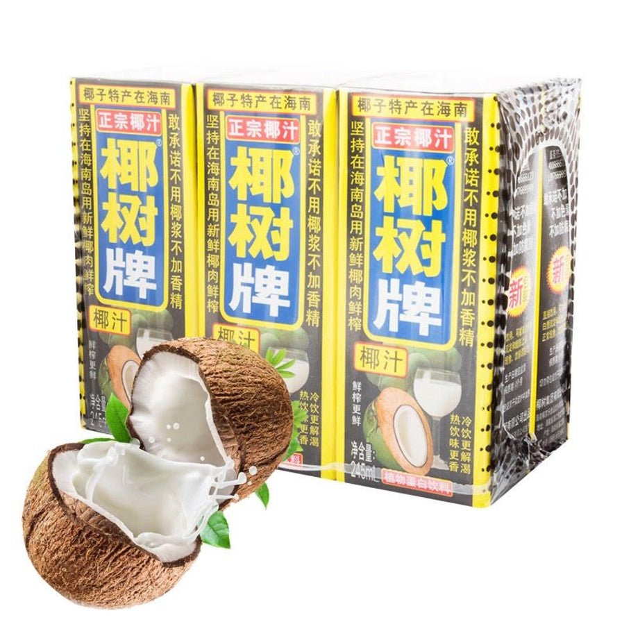 椰树牌椰汁利乐包装，前景为一个剖开的椰子流出新鲜椰奶，背景为成排的椰汁包装盒。