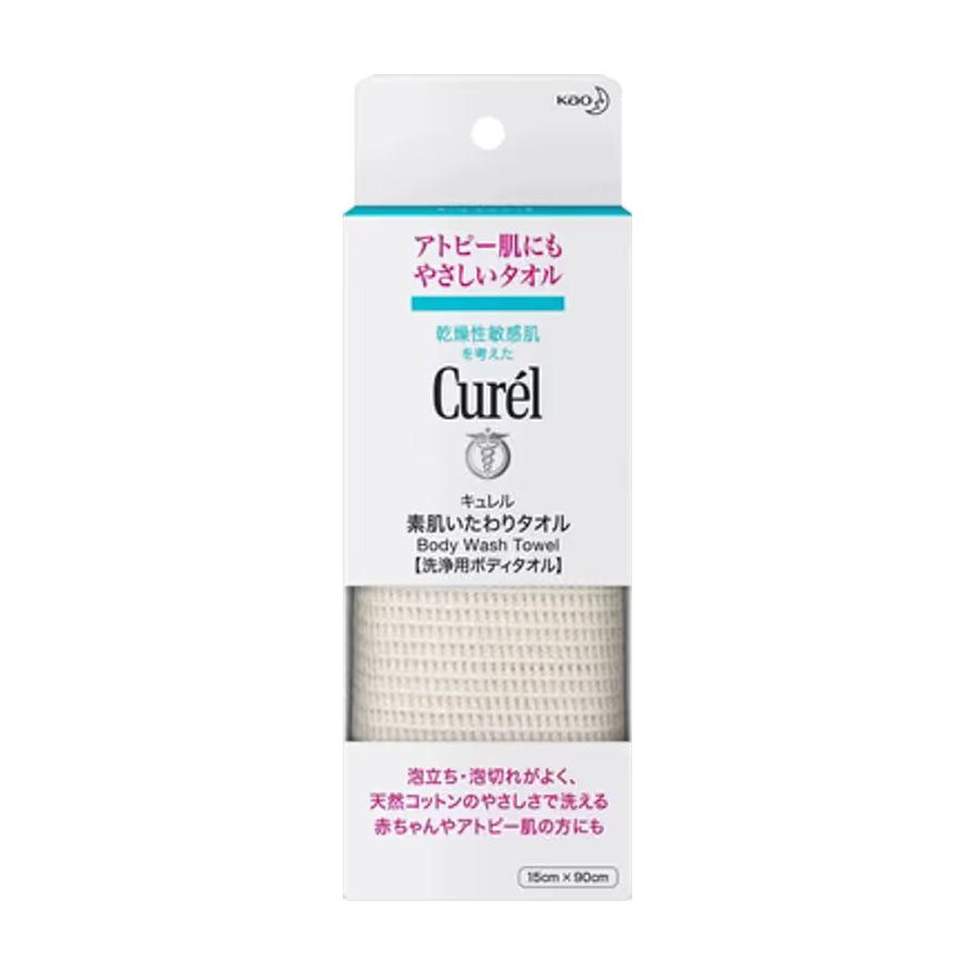 Curel 珂润柔和沐浴搓澡巾包装正面图，白色外盒印有品牌 Logo 及日文说明，中间透明窗口展示米白色天然棉材质织物。