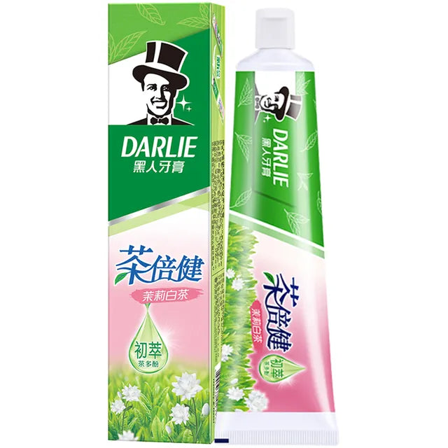 DARLIE 黑人茶倍健茉莉白茶牙膏标准装，展示绿色包装盒与管身正面，印有品牌 Logo 及茉莉花图案。