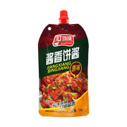 叮当婆酱香饼酱原味130g挤压袋装，包装正面展示了诱人的酱香饼成品图。