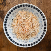 特级淡晒海虾皮包装正面图，展示金黄色自然晾晒的干虾米细节。