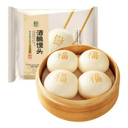盒马酒酿馒头冷冻包装正面，白色袋身印有红色福字和产品名称