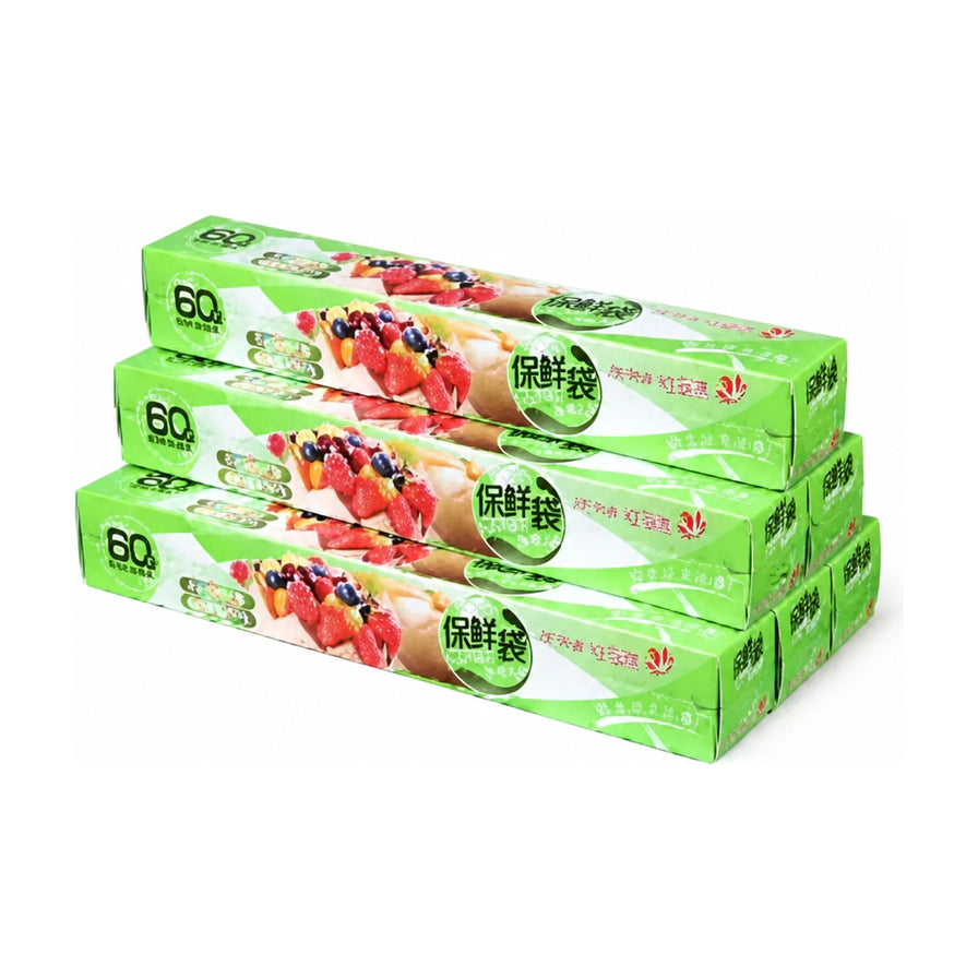 三盒装食品级保鲜膜，绿色包装盒整齐堆叠，展示水果图案和60米规格标识。