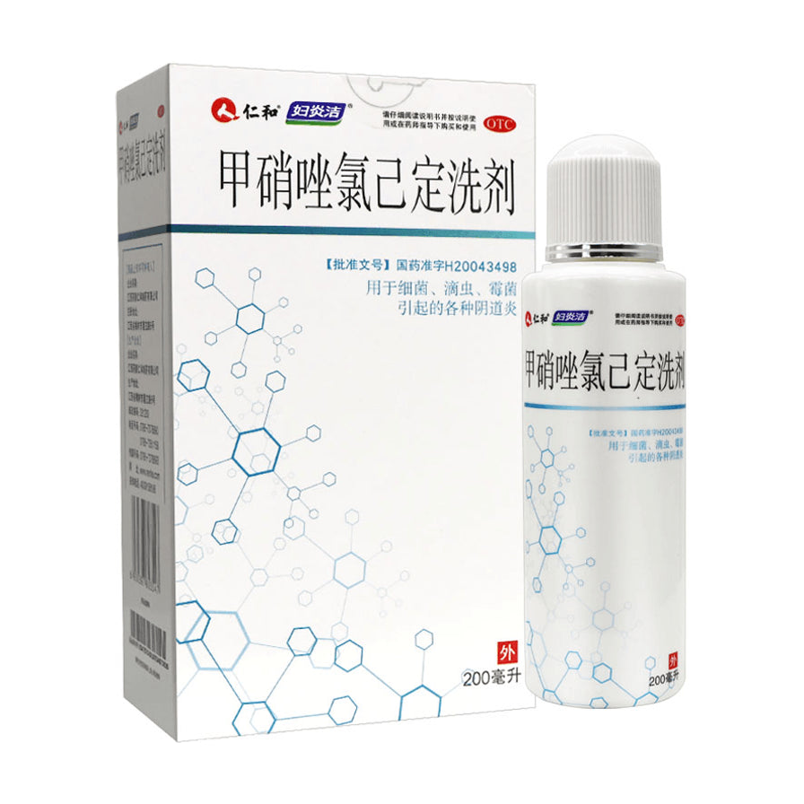 妇炎洁甲硝唑氯己定洗剂200ml，包含外包装纸盒与白色瓶装洗液，包装印有分子结构图案。