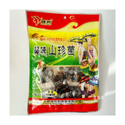 鸿兴美味山珍菌香辣牛肝菌风味外包装，内含独立小包装，包装上有云南少数民族人物插画。