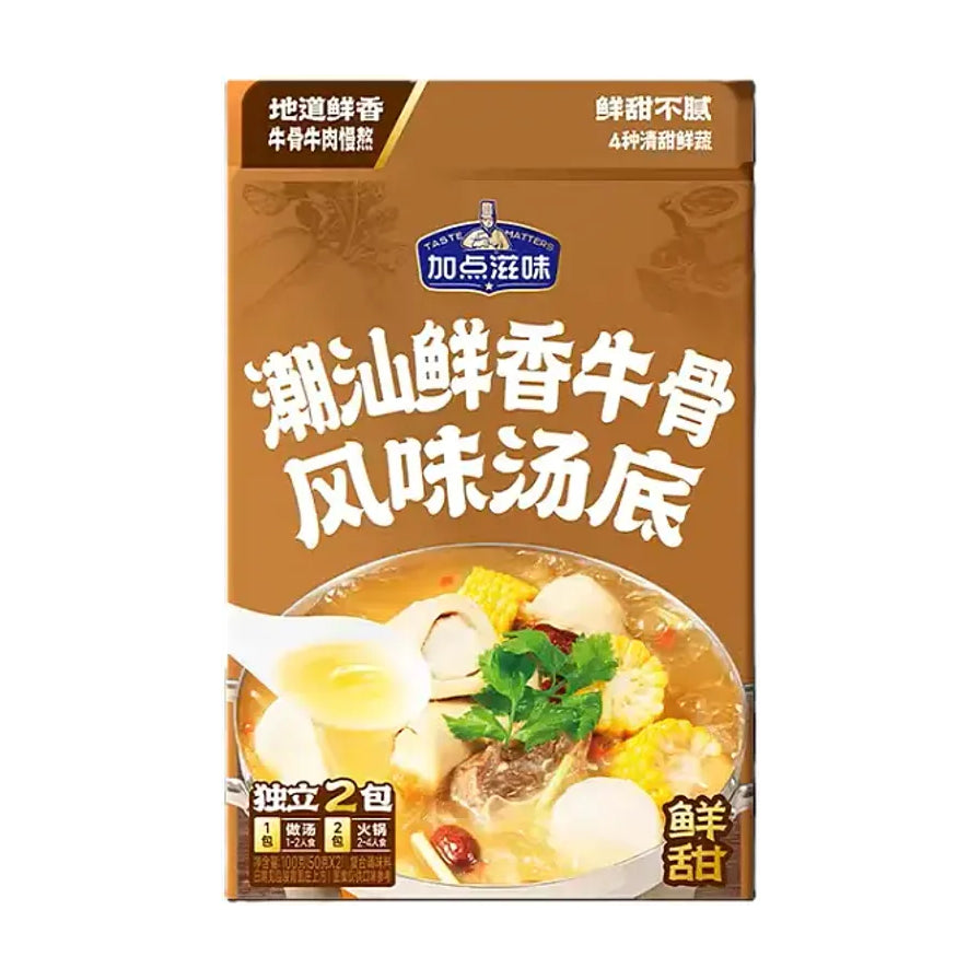 加点滋味潮汕鲜香牛骨风味汤底包装盒正面，棕色背景，印有品牌 Logo、产品名称及含玉米牛肉的汤品食用效果图。