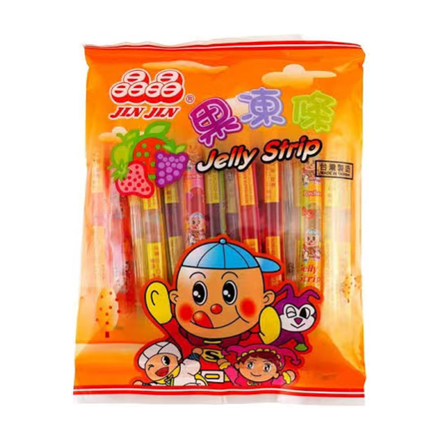 晶晶综合水果味果冻条包装正面图，橙色外袋印有卡通人物和水果图案，内含多种口味的长条形果冻。