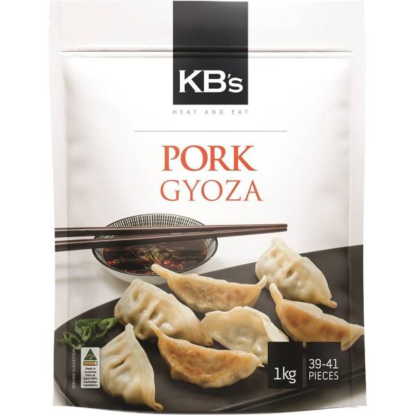 KB's 猪肉煎饺细节图，显示焦香的外皮和多汁的猪肉馅料。