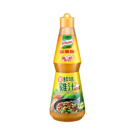 家乐牌鲜味鸡汁 485g 瓶装正面图，黄色标签展示品牌和液态浓缩鸡汁信息。