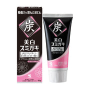 小林制药美白炭力牙膏的黑色外包装盒与软管装牙膏，包装上印有醒目的“炭”字和美白说明，规格为90g。