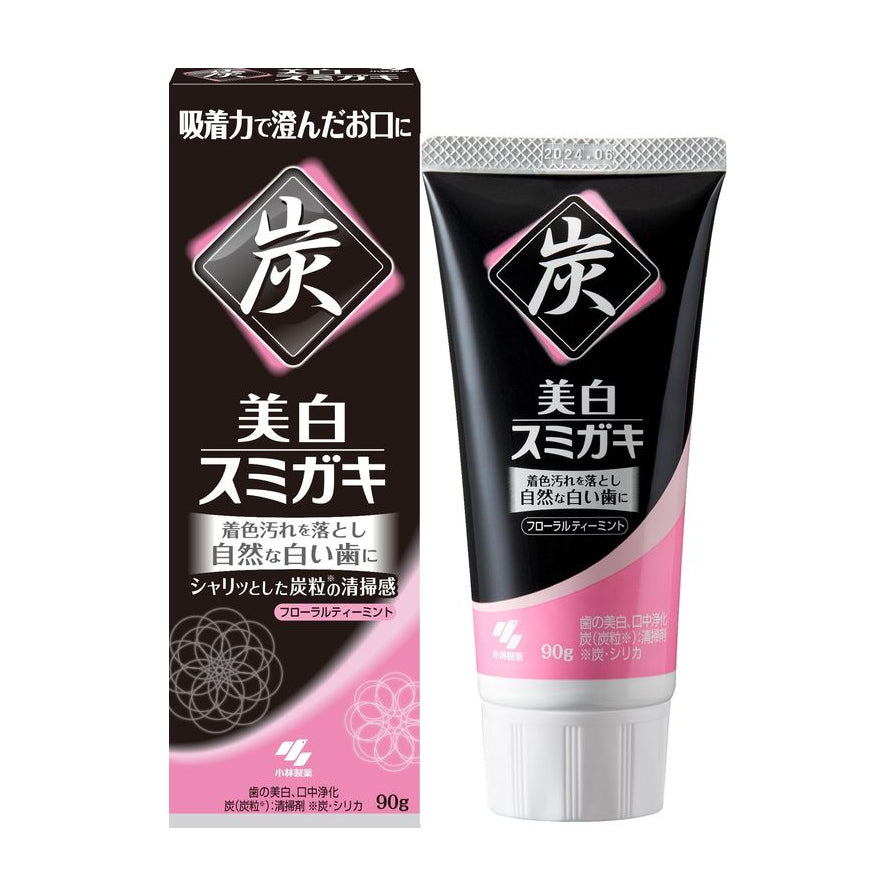 小林制药美白炭力牙膏的黑色外包装盒与软管装牙膏，包装上印有醒目的“炭”字和美白说明，规格为90g。
