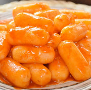 韩国风味爆浆芝士年糕条包装正面，展示 500g 规格与品牌信息