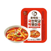 韩国国民学校原味炒年糕600g包装图，红色背景包装盒配以一碗诱人的韩式甜辣年糕实物展示。
