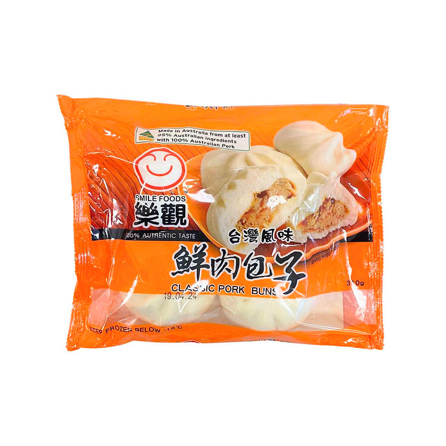 台湾乐观鲜肉包子特写，展示饱满多汁的内馅和 Q 弹面皮