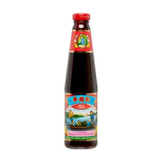 李锦记旧庄蚝油510克玻璃瓶装，正面标签印有经典采蚝图案，瓶颈带有红色封口包装。