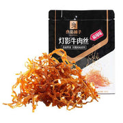 良品铺子灯影牛肉丝麻辣味包装正面，红色调袋装即食零食