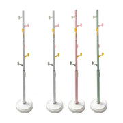 四款不同颜色的小黄鸭落地衣帽架展示，包括白色、粉色和绿色，采用多钩位错落设计和圆形稳固底座。