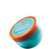 Moroccanoil 强效修复发膜罐装俯视图，橙色盖子搭配蓝绿色瓶身，黑色背景展示产品细节。