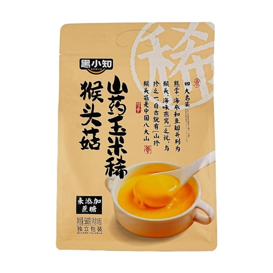 黑小知猴头菇山药玉米稀包装袋正面，黄色背景，印有“未添加蔗糖”字样及冲泡后的黄色糊状实物图。
