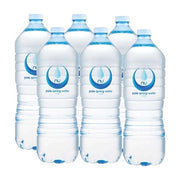 六瓶整箱装的 NuPure 澳洲天然泉水，1.5L 大容量透明瓶身，带有蓝色水滴标志和 pure spring water 字样。