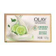 玉兰油黄瓜绿茶香皂正面包装图，展示绿色黄瓜切片与白色乳液飞溅效果，金色边框设计。