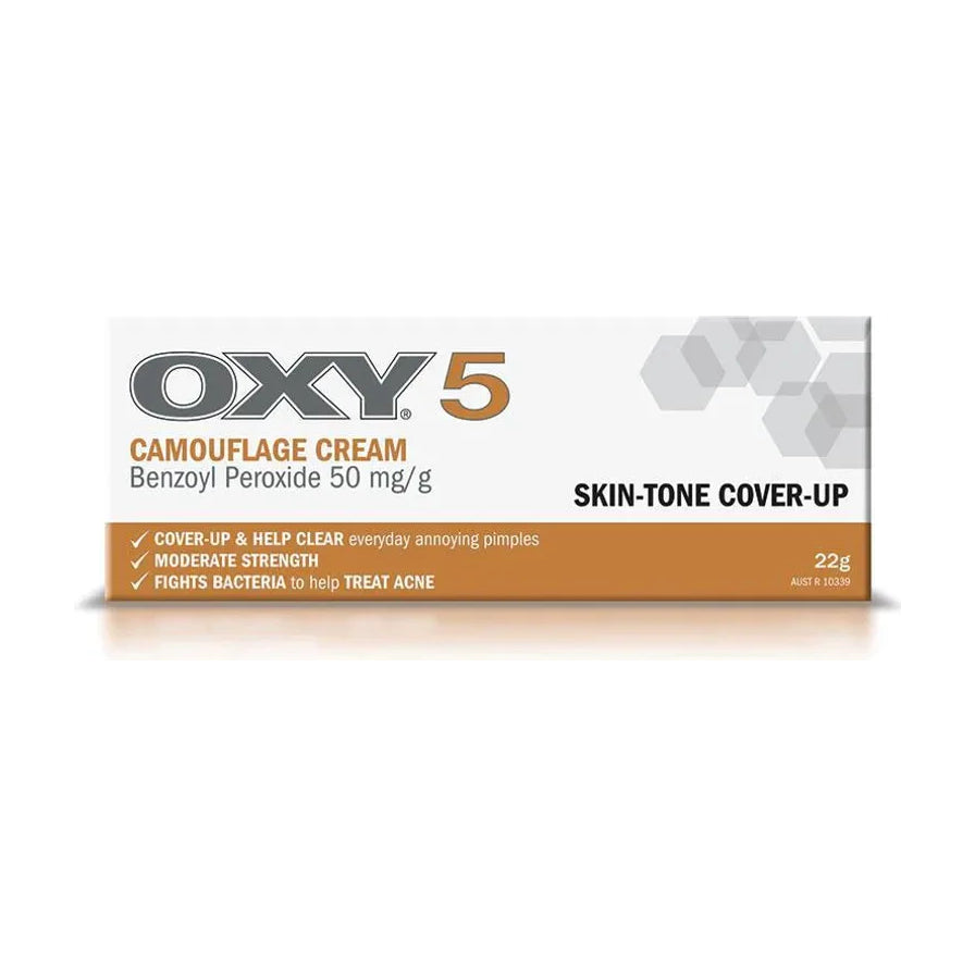 OXY 5 遮瑕祛痘膏盒装正面图，白底展示包装，盒身可见 CAMOUFLAGE CREAM、Benzoyl Peroxide 50 mg/g、SKIN - TONE COVER - UP 和 22g 字样