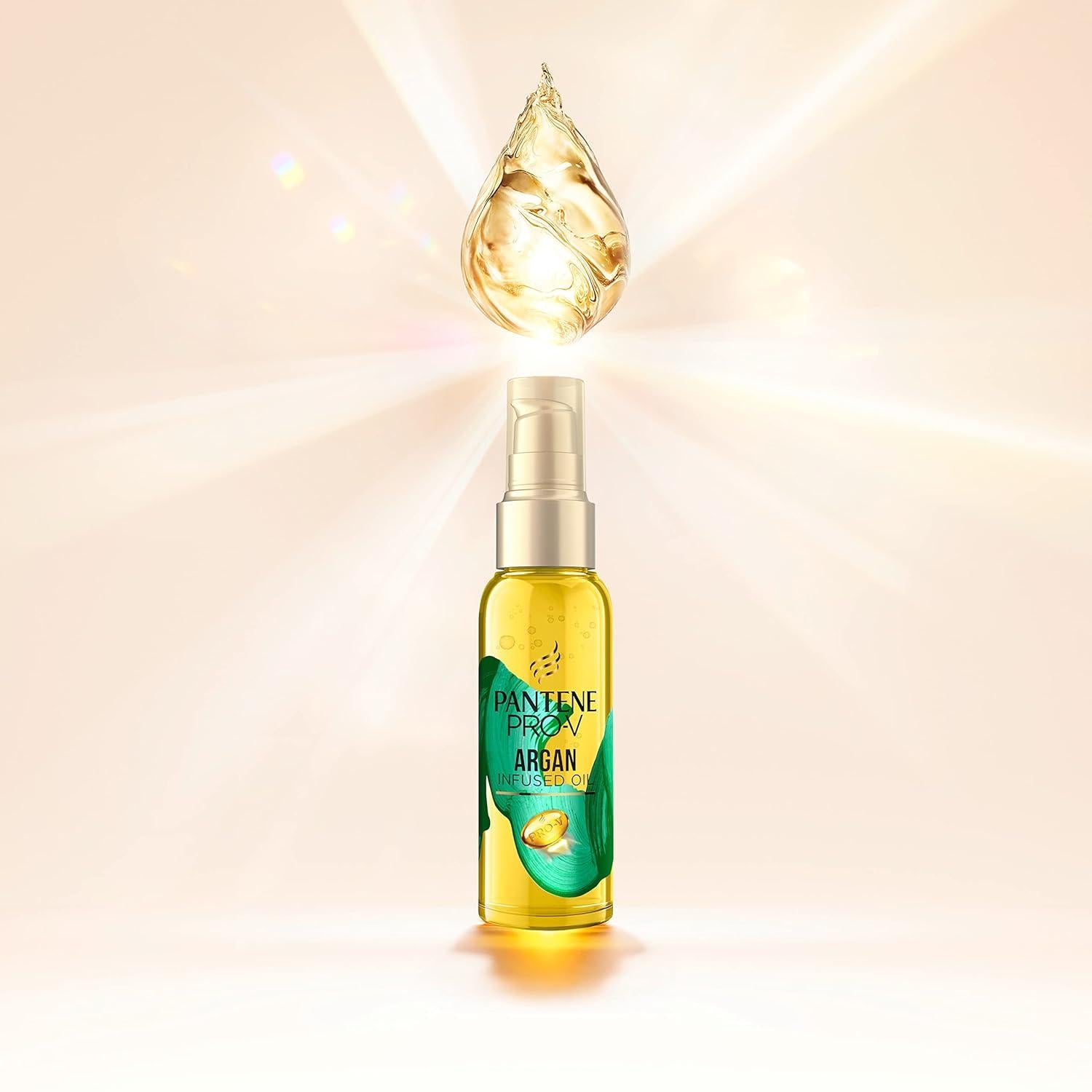 Pantene Pro - V 护发精油产品创意图，金色精华液滴悬浮于瓶口上方，背景带有柔和光效。