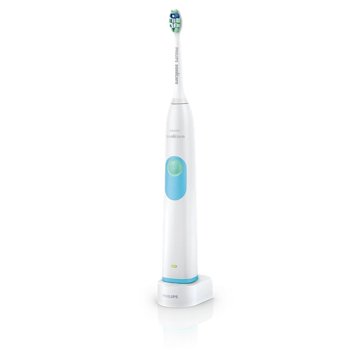 Philips Sonicare 电动牙刷主机置于充电底座上的正面特写，白色机身搭配蓝色按键，黑色背景。
