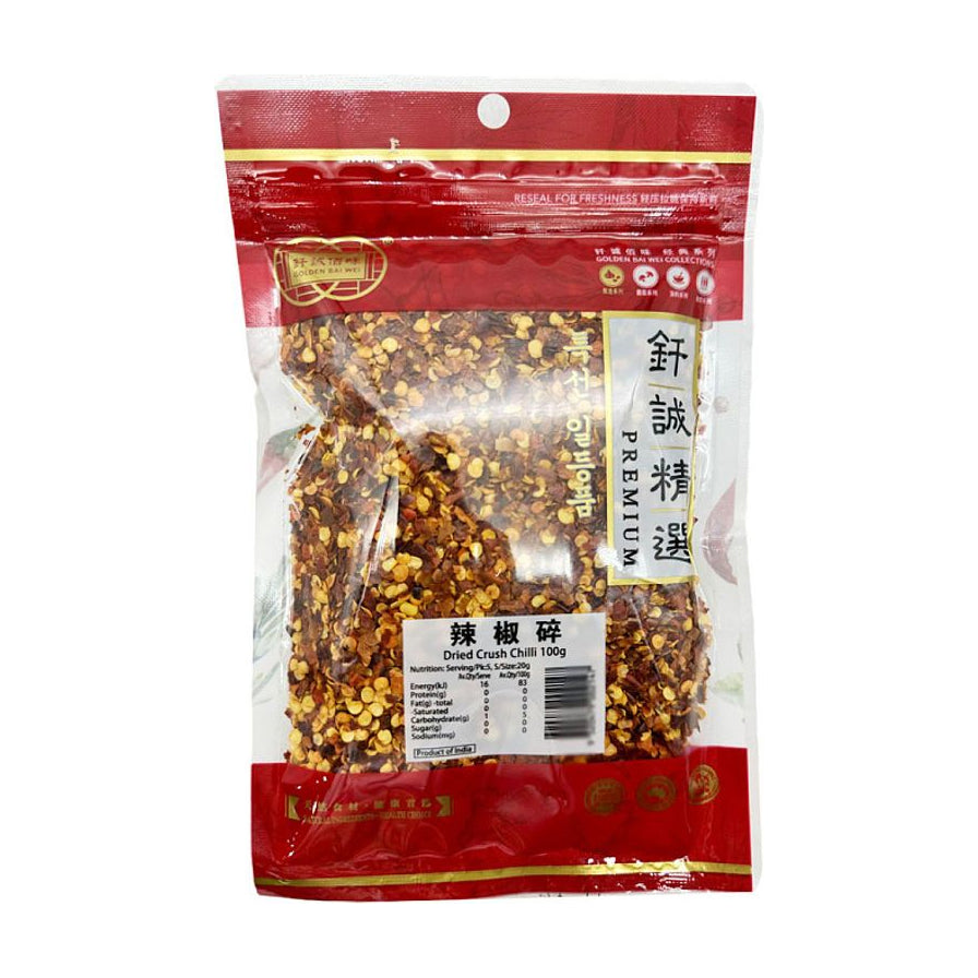 钎诚精选辣椒碎100g袋装，透明包装可见内部均匀的干辣椒颗粒，包装正面印有品牌名及营养成分表。