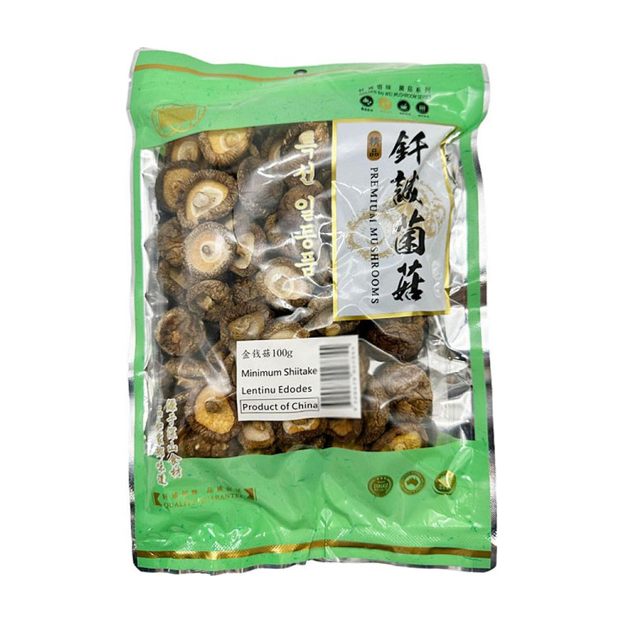 钎诚金钱菇100g包装正面图，透明包装展示内部干燥的小巧金钱菇，包装上有品牌名和产品规格标签。