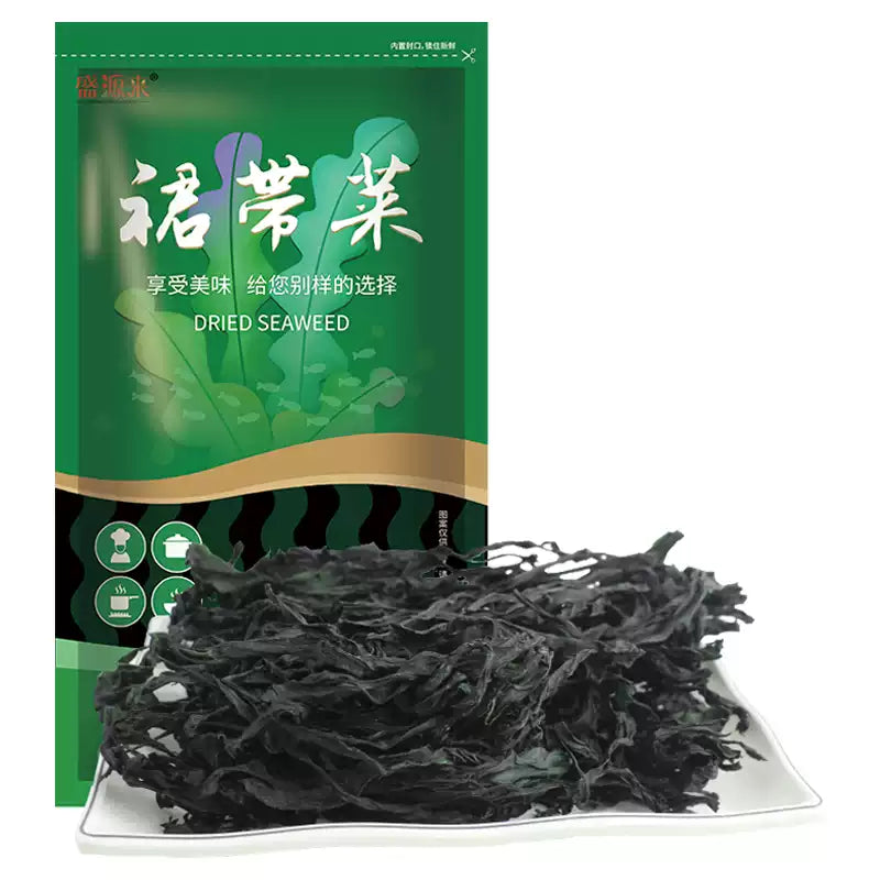 盛源来干裙带菜 100g 包装袋正面，展示翠绿压缩海藻与品牌信息
