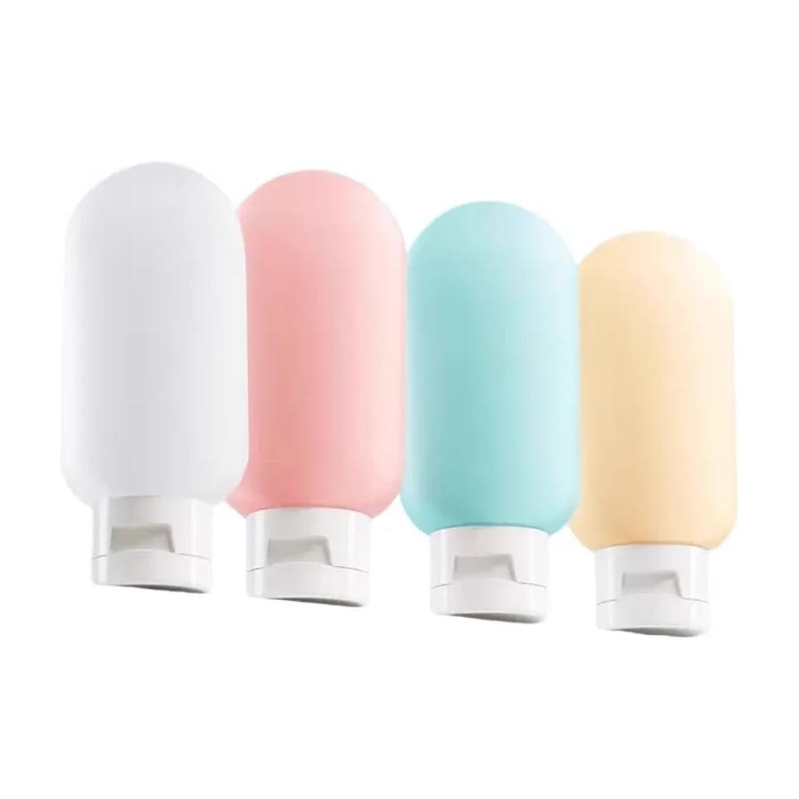 四只彩色硅胶旅行分装瓶正面展示，包含白粉蓝黄四种颜色，配有白色翻盖。