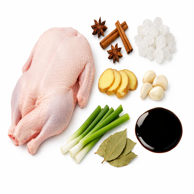 制作酱鸭的原料俯拍图，包含整鸭、八角、桂皮、冰糖和酱油