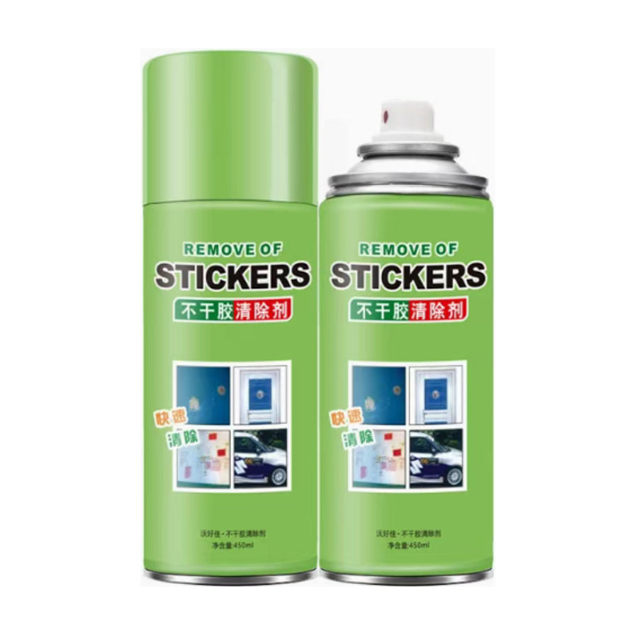 两瓶绿色罐装的不干胶清除剂，瓶身印有REMOVE OF STICKERS和不干胶清除剂字样，展示了喷头和瓶盖，净含量450ml。