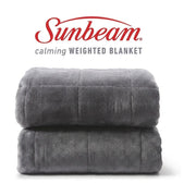 Sunbeam 灰色天鹅绒加重毯折叠展示，上方带有 Sunbeam 品牌标识和 Calming Weighted Blanket 字样。