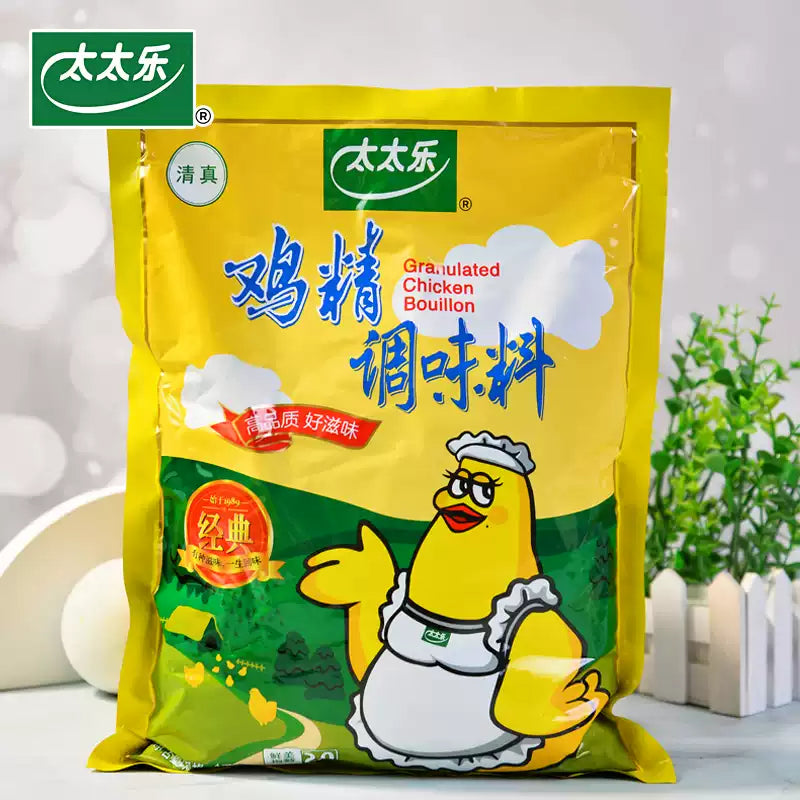 太太乐鸡精调味料 1kg 大包装正面图，白色袋身印有红色品牌标识